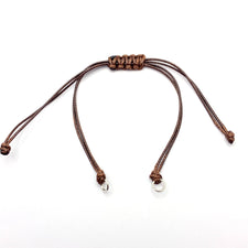 brown cord bracelet with silver jump rings