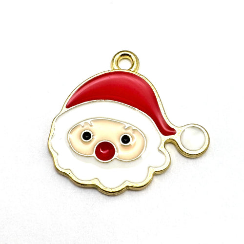 red white and gold jewelry charm that looks like santa claus