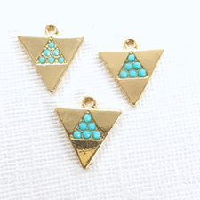 3 gold color jewelry charms shaped like triangles