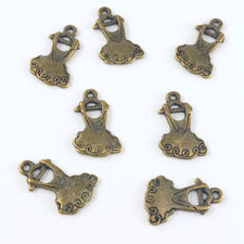 bronze colour jewelry charms that look like dresses