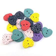 heart shaped buttons that are in multiple colours with polka dots on them