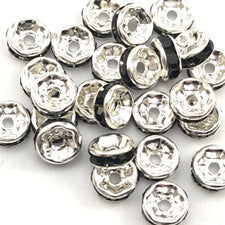 pile of silver and black color rondelle jewelry beads