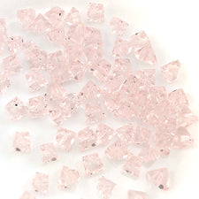 light pink jewelry beads that are triangle shape