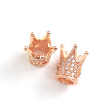 Rose gold colour jewerly beads shaped like a crown with rhinestones on them
