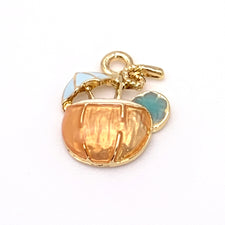 gold, orange and blue jewerly charms that look like a beverage glass