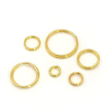 6 different sized gold colour split rings