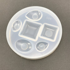 clear silicone mold with six pendant shaped holes
