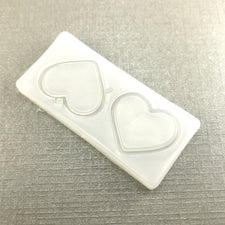 clear silicone mold with heart shaped curing cutouts