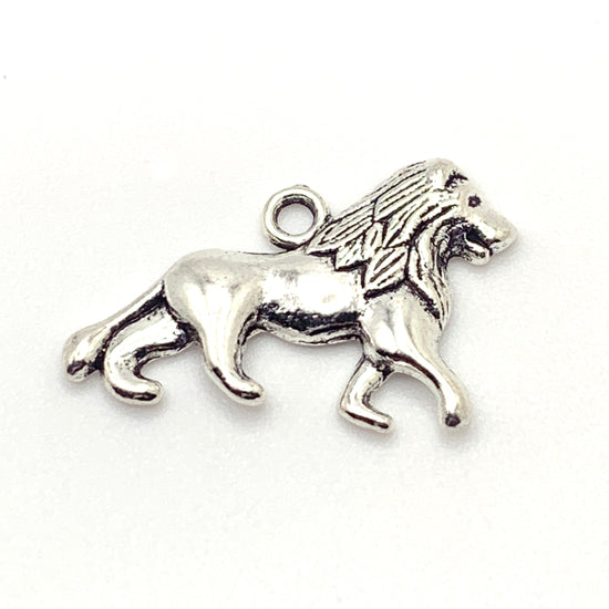 silver colour jewerly charm that looks like a lion