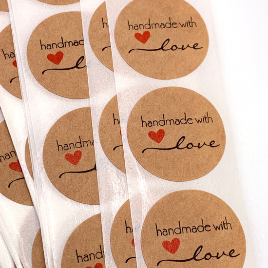 round beige stickers that say Handmade With Love on them with a red heart