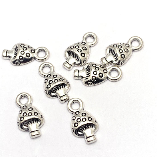 silver jewelry charms that look like mushrooms