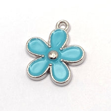 blue and silver flower shaped jewelry charm