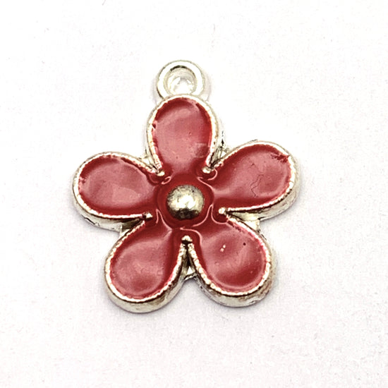 red and silver flower shaped jewelry charm