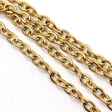 gold coloured jewelry chain with oval links