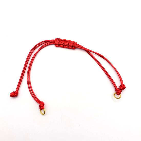 red adjustable cord bracelet with gold jump rings