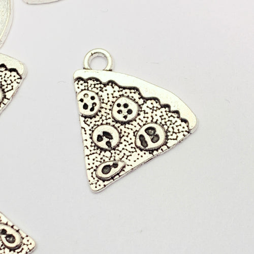silver colour jewelry charms that look like a slice of pizza