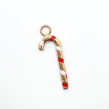 gold, red and white jewelry charms shaped like candy canes