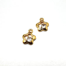 Two gold and clear rhinestone star shaped jewelry charms