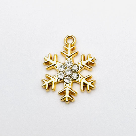 light gold snowflake shaped pendant with crystal rhinestones