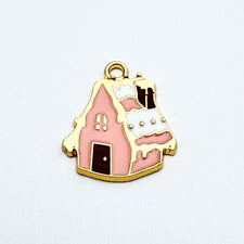 pink and gold jewelry charm shaped like a house