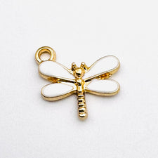 white and gold dragonfly shaped jewelry charms
