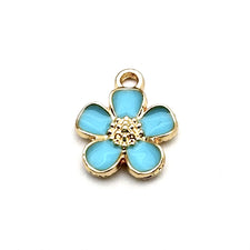 blue and gold jewerly charm in the shape of a 5 petal flower