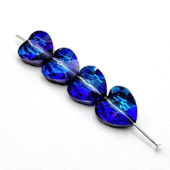 heart shaped blue glass beads with purple highlights