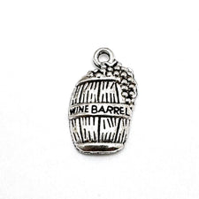 silver jewelry charms in the shape of a wine barrel