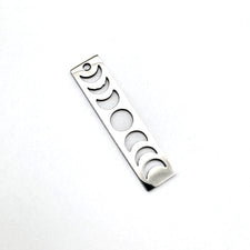 silver bar shaped jewelry charm that shows phases of moon