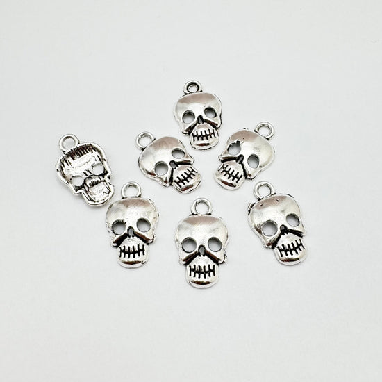 silver colour skull shaped charms