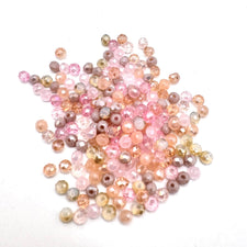 rondelle faceted beads that are a mix of pink toupe, peach colours