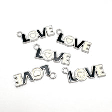 white and black charms of the word Love