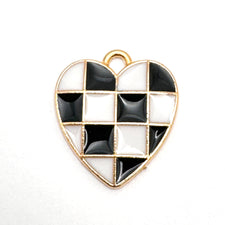 black and white heart shaped jewelry charms in a checkered pattern