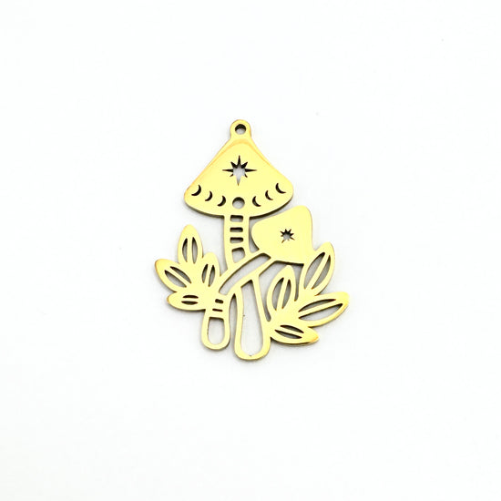 gold pendant in the shape of mushrooms