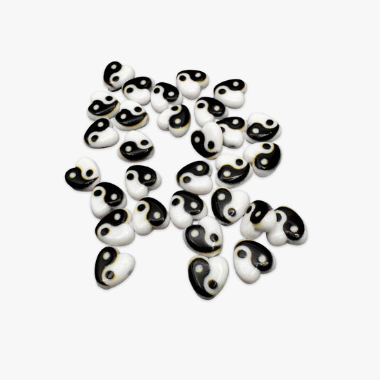 black and white heart shaped beads with yin yang design