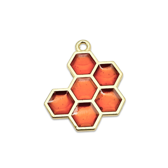 orange and gold charm that looks like honeycomb