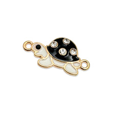 black white and gold connector charms that looks like tortoises