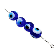 round blue beads with evil eye pattern