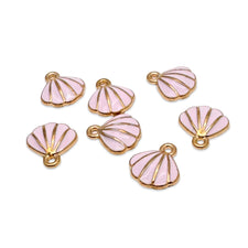 Seven pink and gold scallop shell shaped jewelry charms