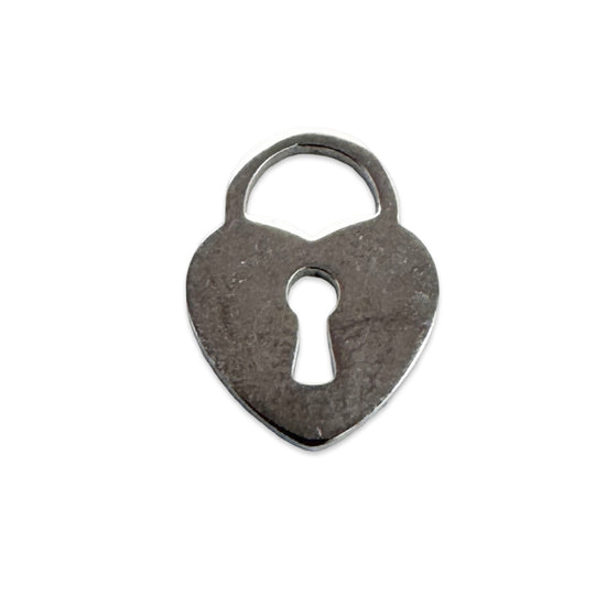 silver colour jewelry charm in the shape of a lock with a keyhole