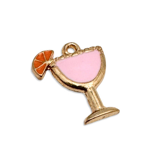 gold and pink jewelry charms in the shape of a cocktail glass with orange slice