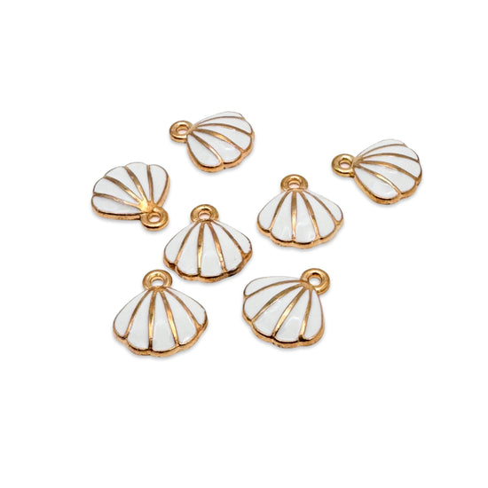 scallop shell shaped jewelry charms that are white and gold