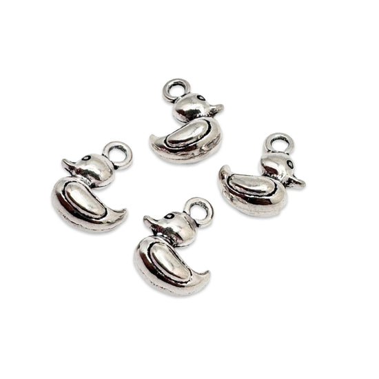 silver jewerly charms in the shape of a duck