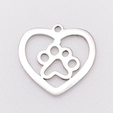 silver heart pendant with a paw print inside