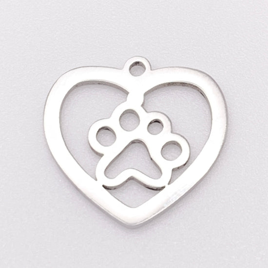 silver heart pendant with a paw print inside