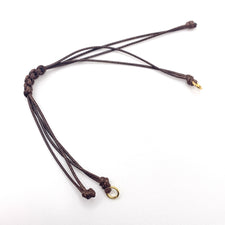 brown cord bracelet with adjustable slider and gold jump rings