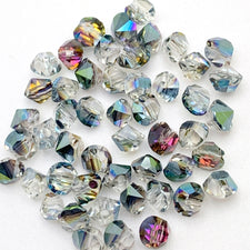 diamond shape jewelry beads that are clear with green, purple, blue colours