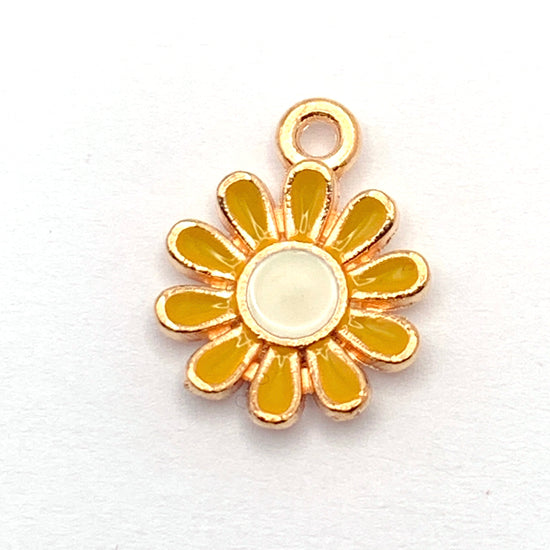 yellow white and gold flower shaped jewelry charms