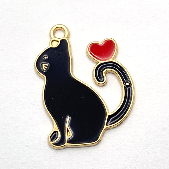 jewerly charms that are a black cat with a red hear on it's tail