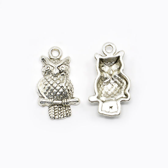 Silver owl charms showing front and back